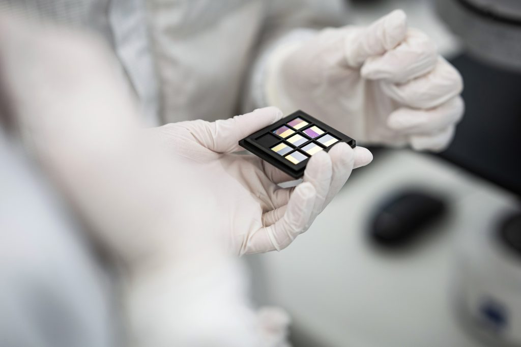 Closeup of object helt with protective gloves